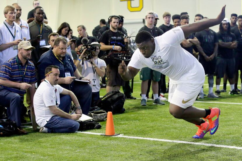 Defensive lineman Andrew Billings runs a speed drill for NFL scouts during the Pro Day...
