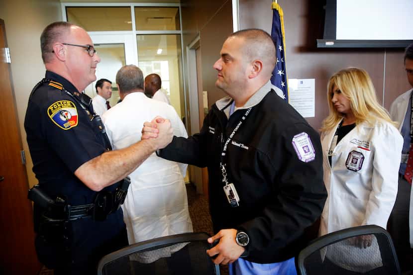 Captain Dan Birbeck of the Dallas County Hospital District Police (left) and Dr. Alexander...