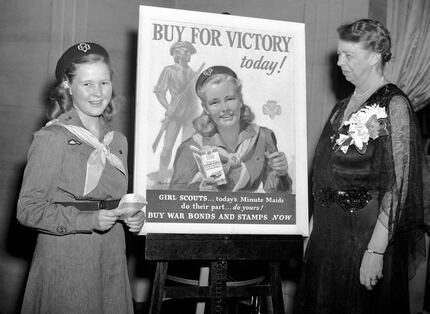 In this March 9, 1943 file photo, Eleanor Roosevelt, right, stands with Girl Scout Betty...