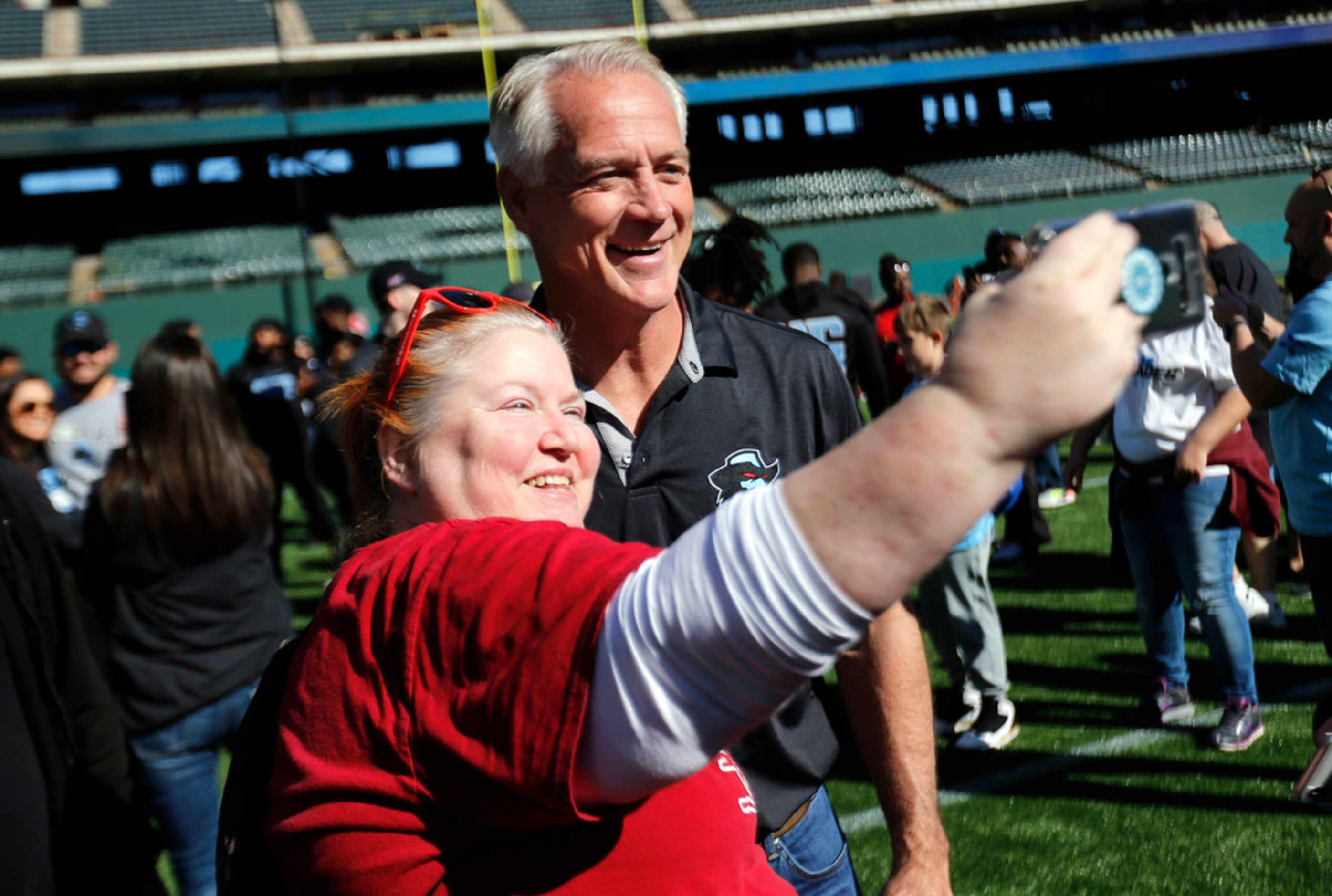 Dallas Renegades fan Rhonda Reddick of Euless, Texas takes a selfie with director of player...