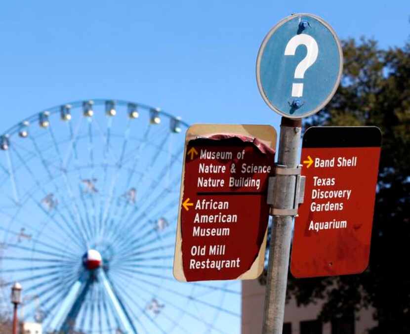 
A peeling sign directs people to some of the attractions still open at Fair Park. Mayor...