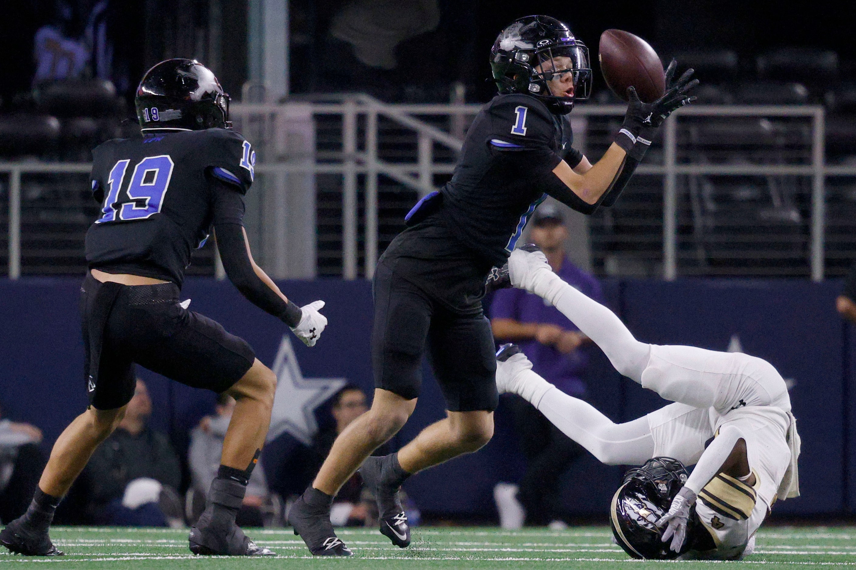 Gunter's Brock Boddie (1) intercepts a pass intended for Woodville's Kevunte Mcdaniel (4),...