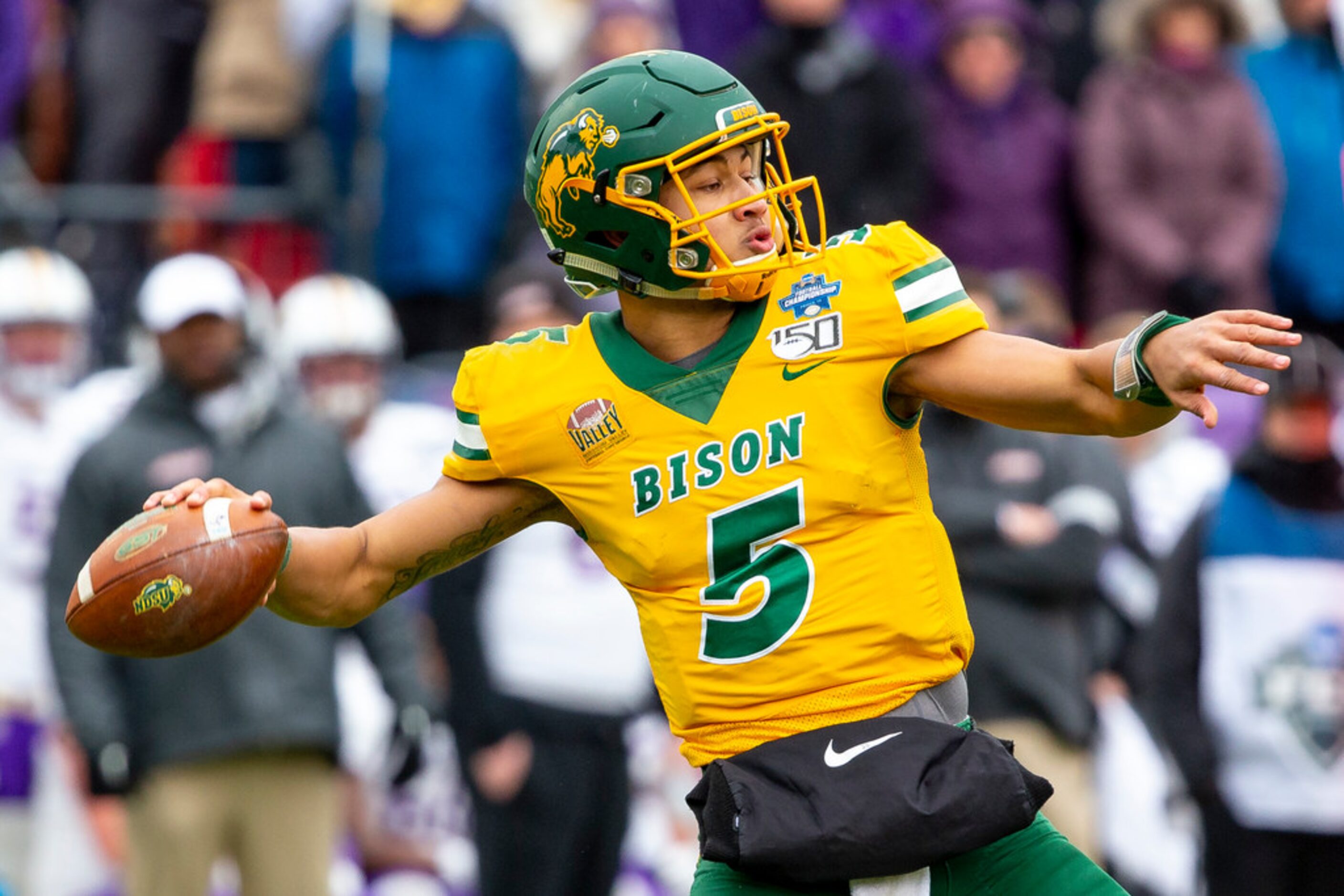 North Dakota State quarterback Trey Lance (5) winds up to throw during the first half of the...