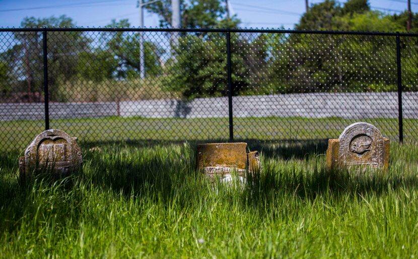  Three of the original gravestones of the Smith family cemetery still stand in southern...