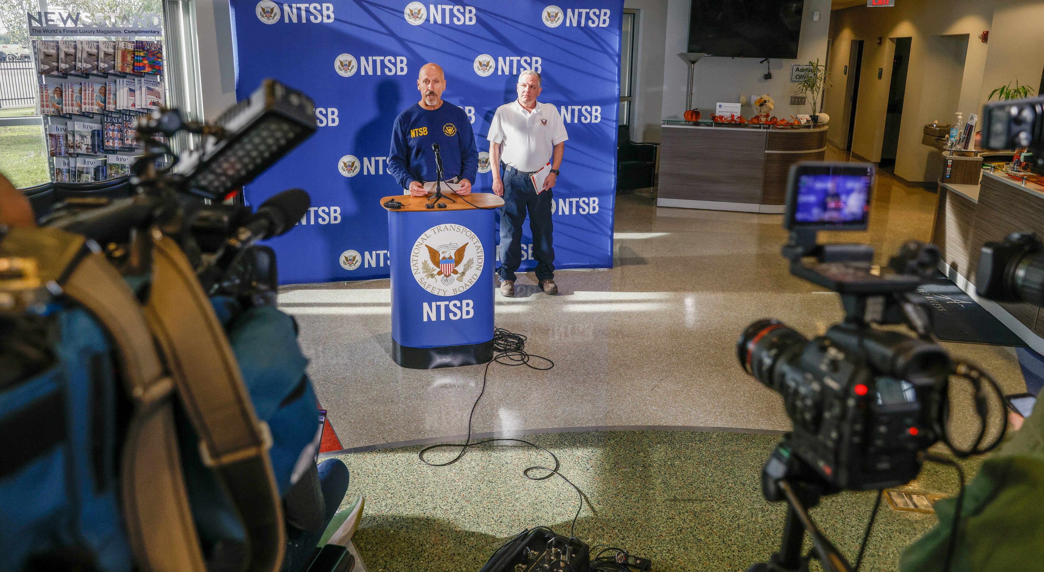 National Transportation Safety Board member Michael Graham (left) speaks to the press at the...