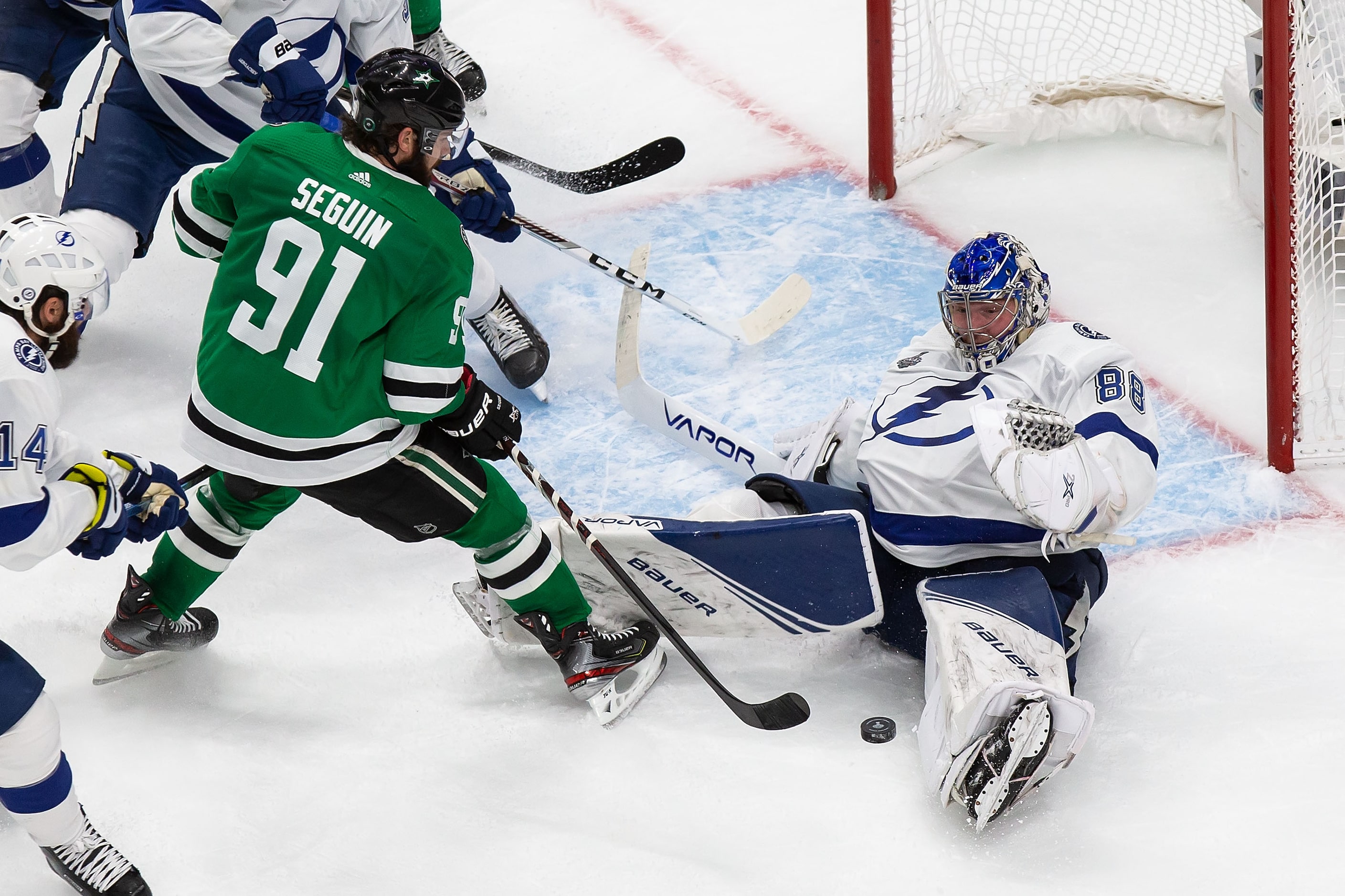 Tyler Seguin (91) of the Dallas Stars takes a shot against goaltender Andrei Vasilevskiy...