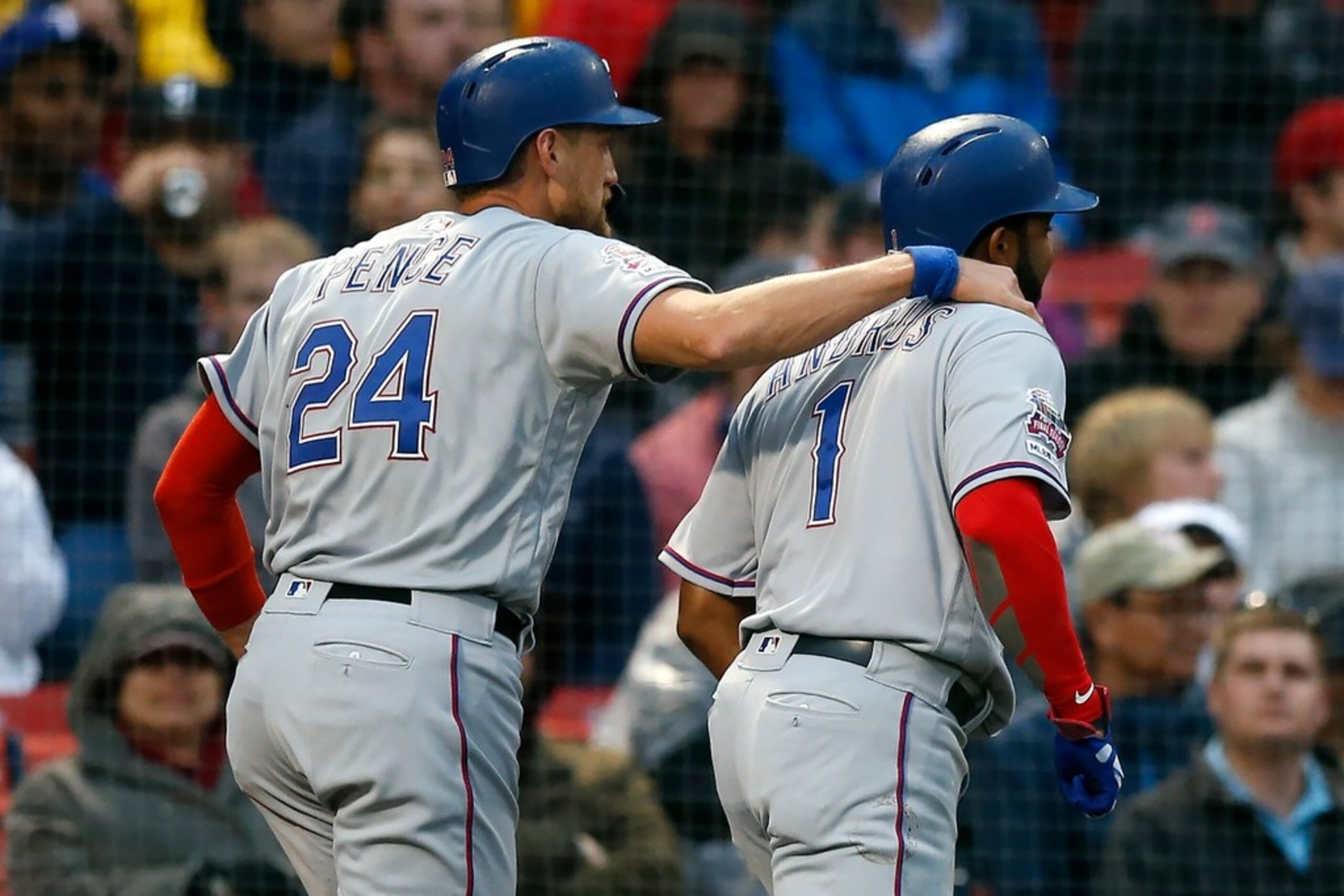 Texas Rangers' Hunter Pence (24) and Elvis Andrus (1) celebrate after scoring on a two-run...