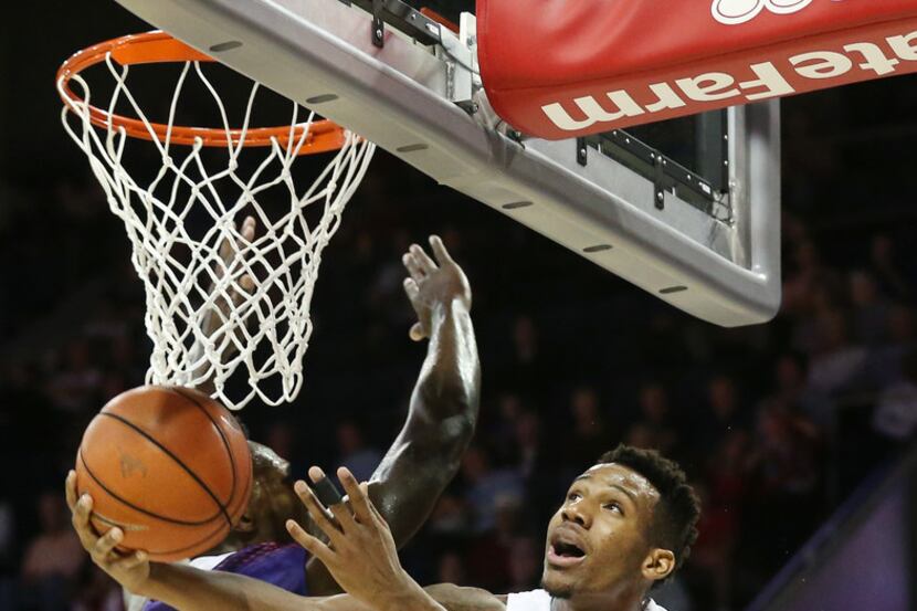 Southern Methodist Mustangs guard Jarrey Foster (10) puts up a shot against Northwestern...