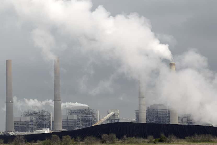 Piles of coal are shown at NRG Energy's W.A. Parish Electric Generating Station Wednesday,...