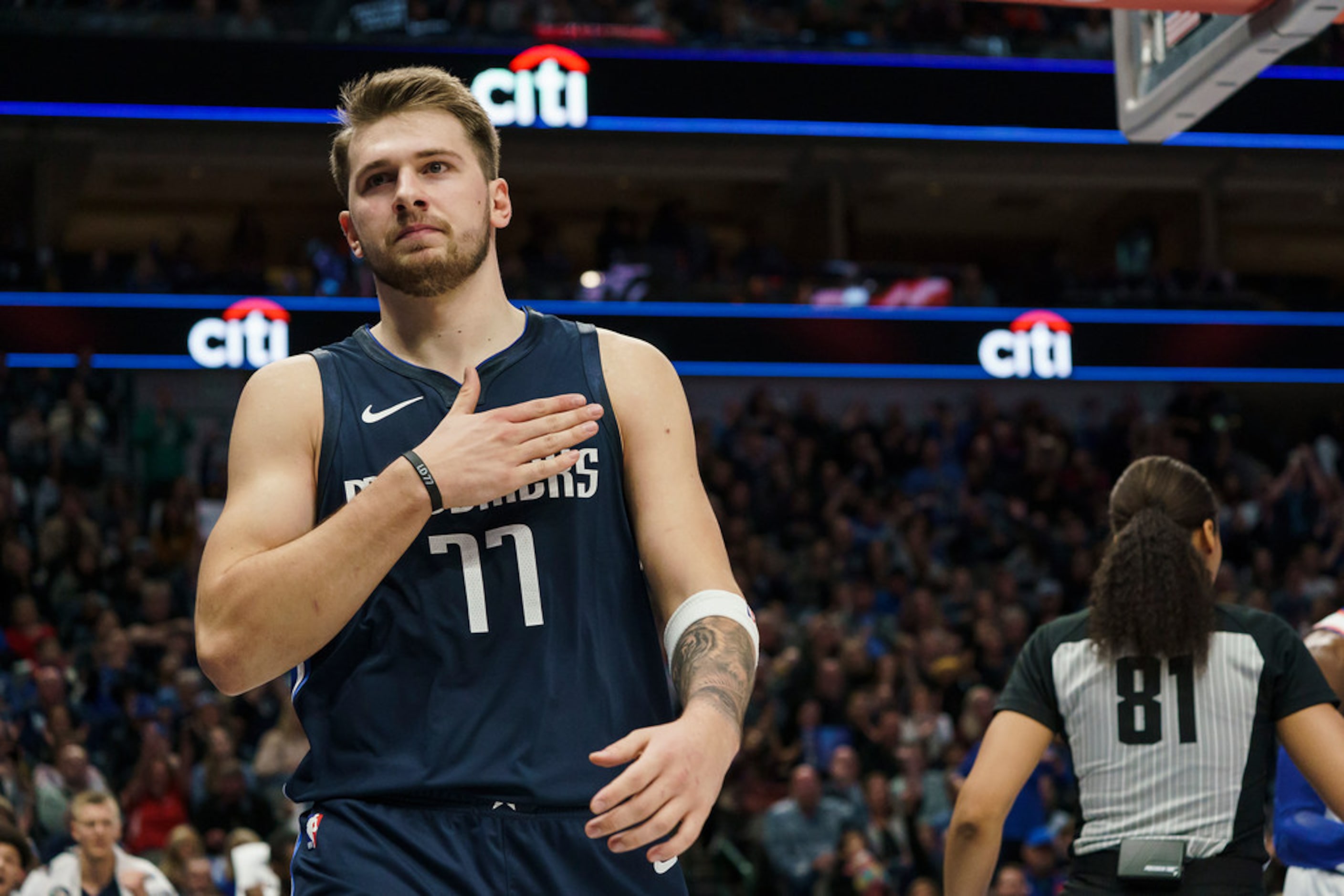 Dallas Mavericks guard Luka Doncic (77) celebrates a basket during the first half of an NBA...