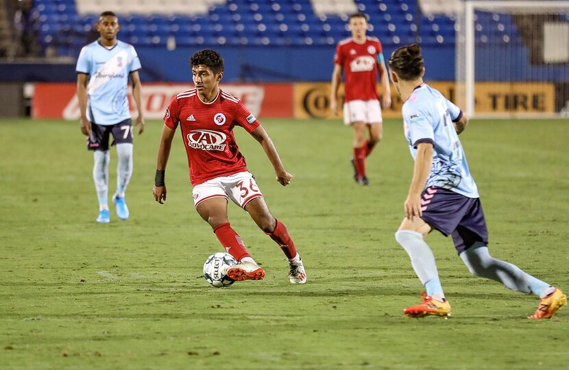 Imanol Almaguer looks to pass against Forward Madison in the North Texas SC playoff...