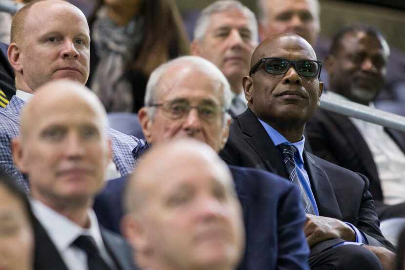 Former University of Iowa football player Malcolm Christie (right) sits among other former...
