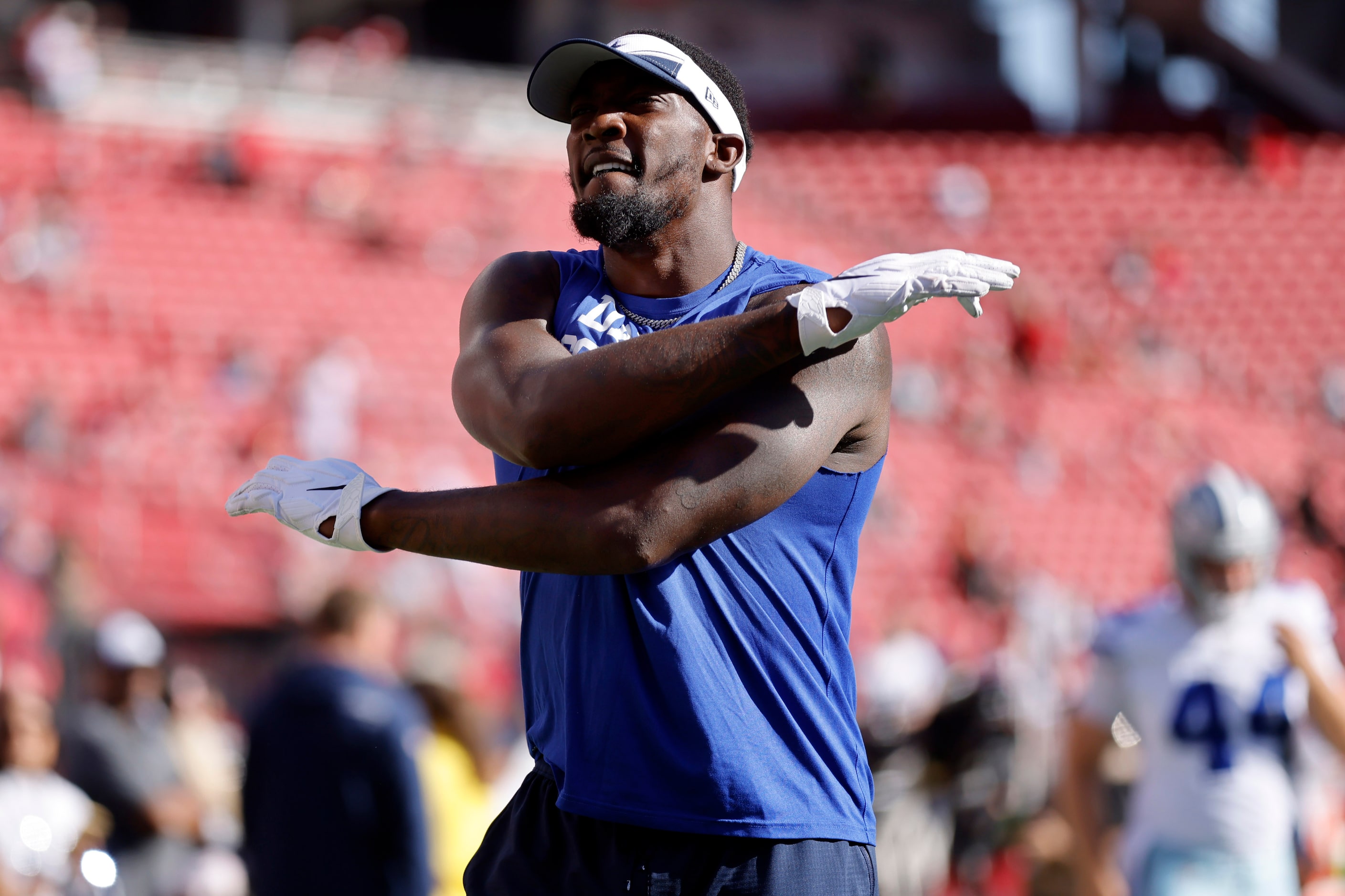 Dallas Cowboys defensive end DeMarcus Lawrence (90) stretches during pregame warmups before...