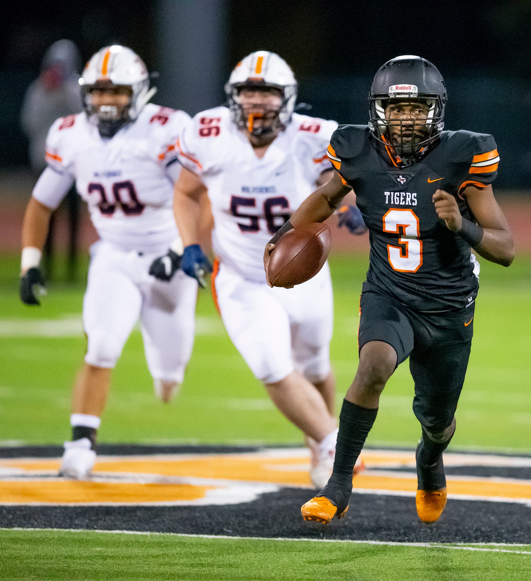 Lancaster junior quarterback Glenn Rice Jr. (3) carries the ball during the first half of a...