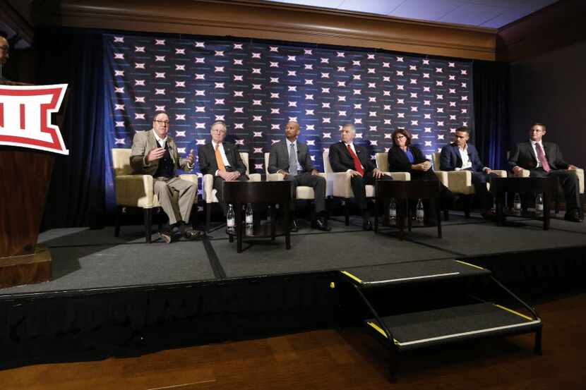 Michael Kim, 120 Sports, at podium, moderates the Big 12 Conference State of College...