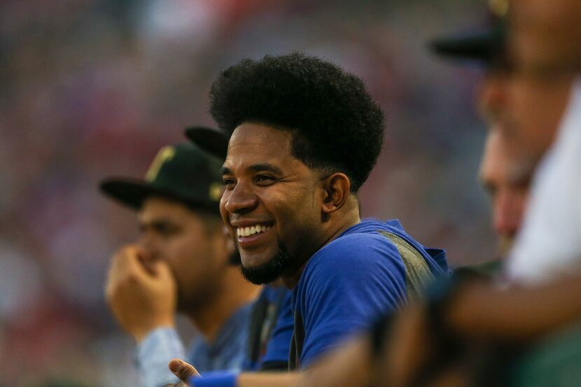 Elvis Andrus reacts from the dugout during a matchup between the Texas Rangers and the St....