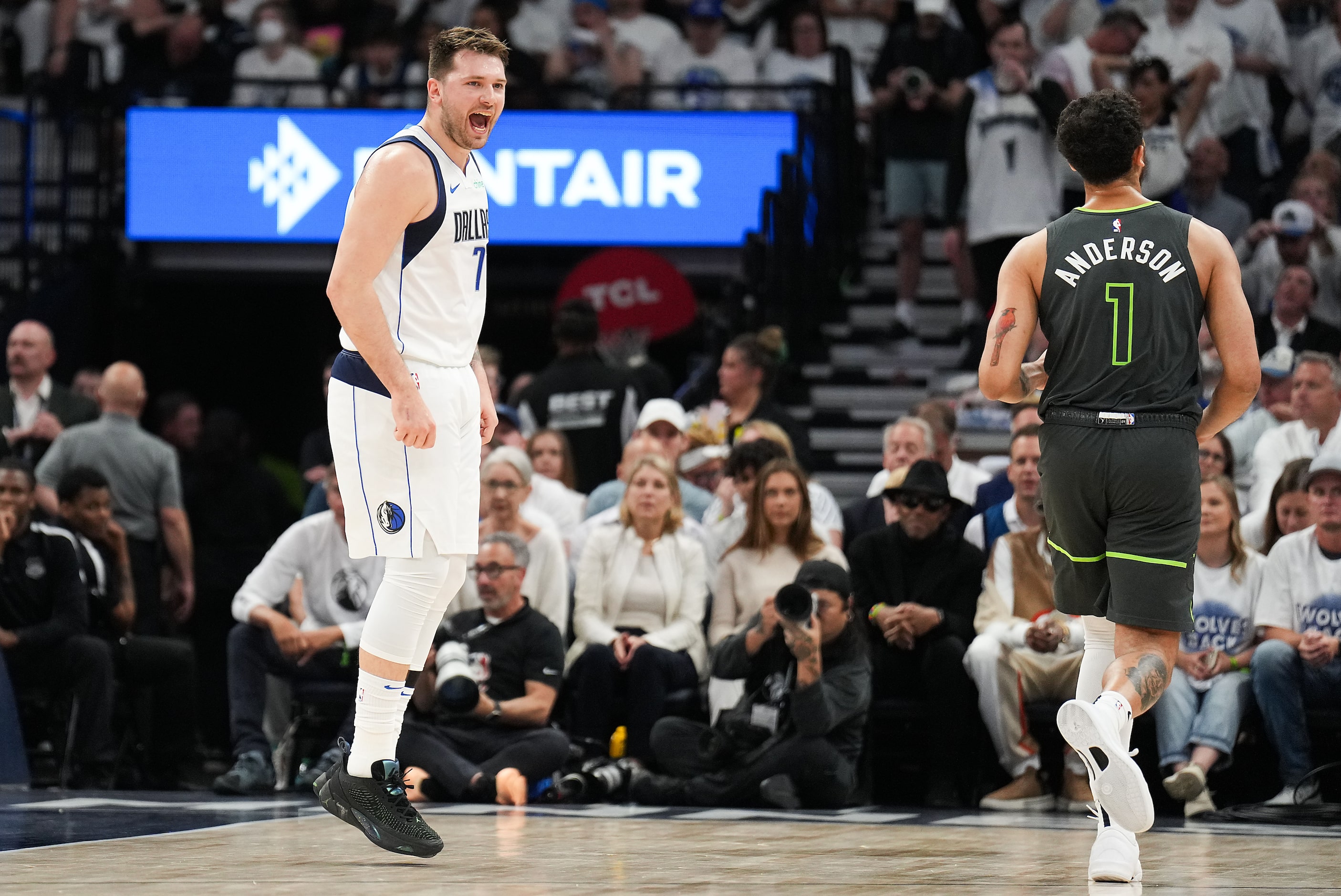 Dallas Mavericks guard Luka Doncic (77) yells toward Minnesota Timberwolves forward Kyle...