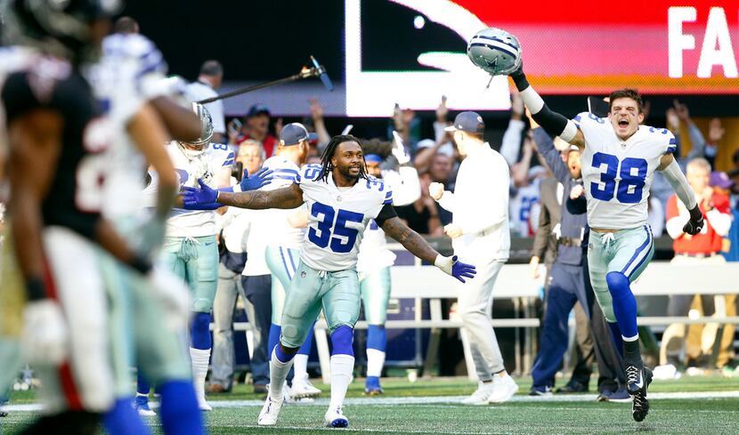 Dallas Cowboys strong safety Jeff Heath (38) and free safety Kavon Frazier (35) celebrate...