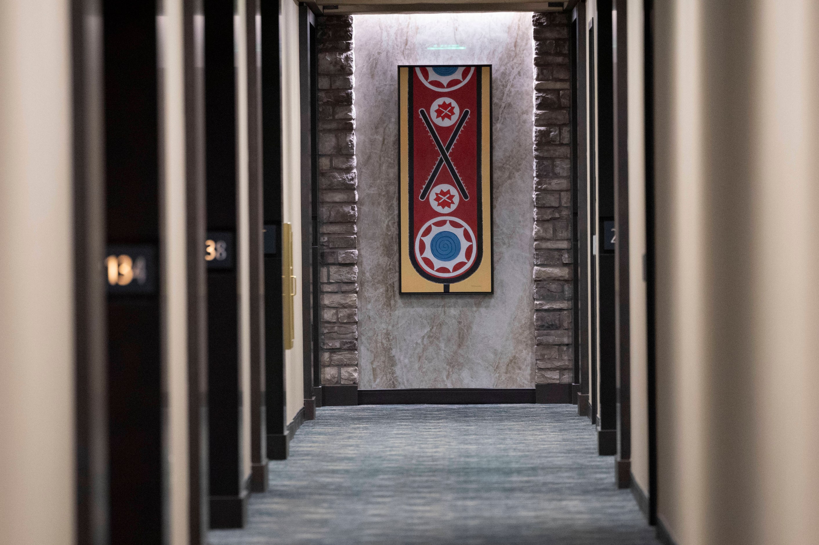 A close up image of a Choctaw baldric sash decorates the end of a hotel hallway at Choctaw...