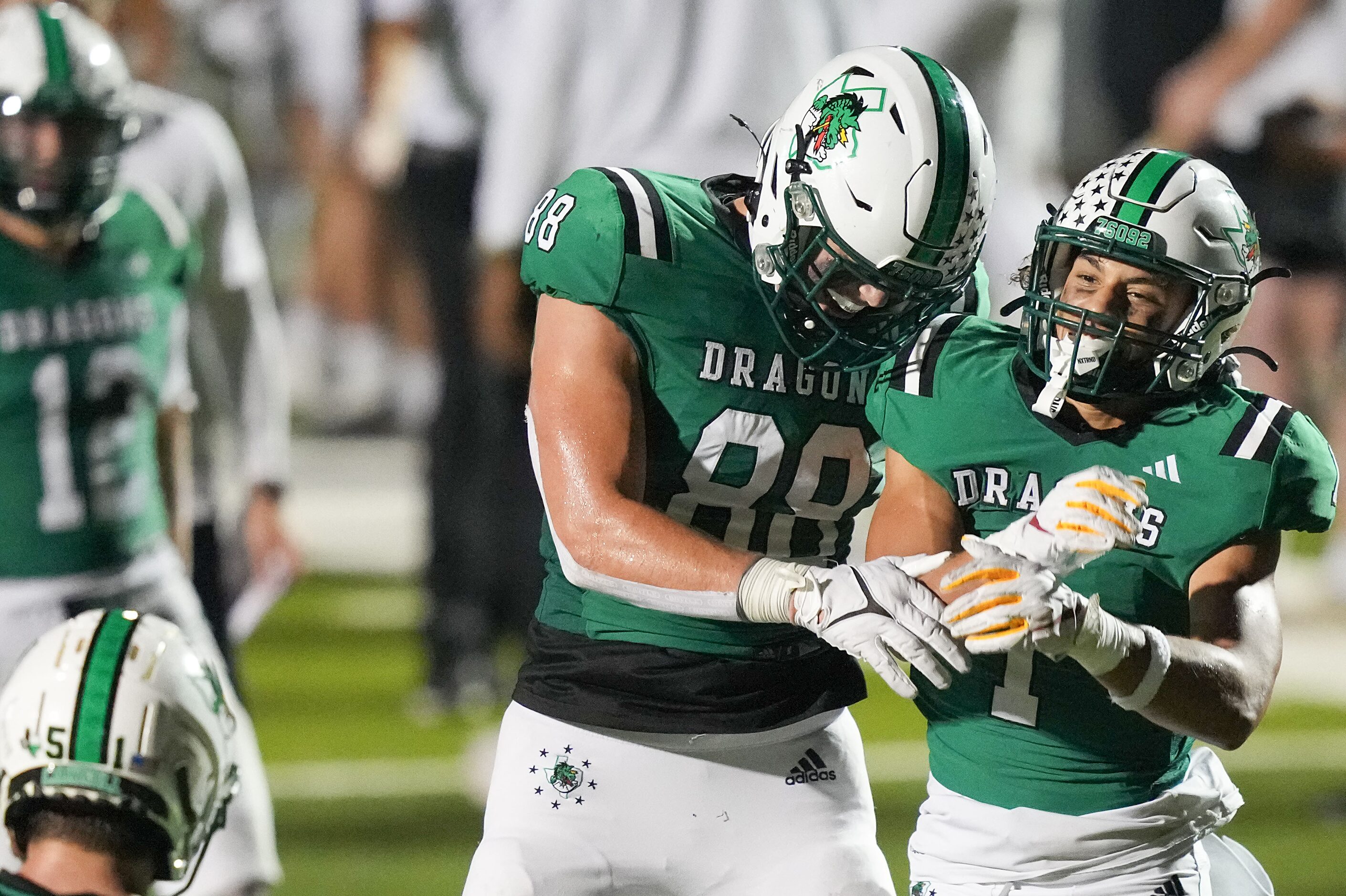 Southlake Carroll running back Riley Wormley (1) celebrates a touchdown run with Jack Van...