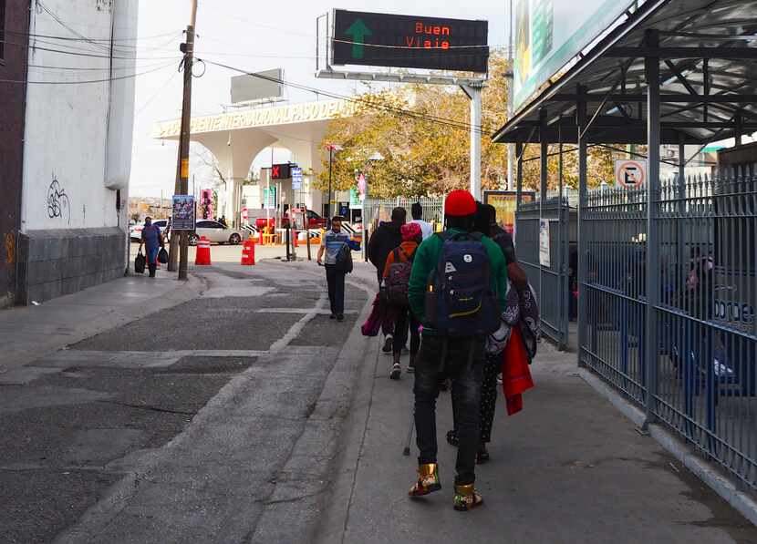 A Haitian family walks towards the Santa Fe International Bridge hoping to cross into the...