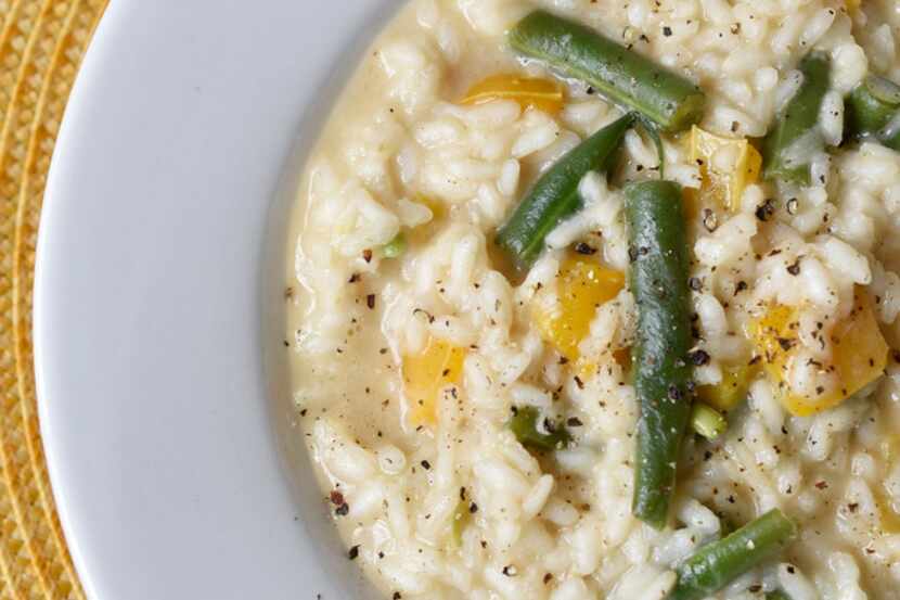 A dish of Marcella Hazan's risotto with green beans and sweet yellow bell peppers 