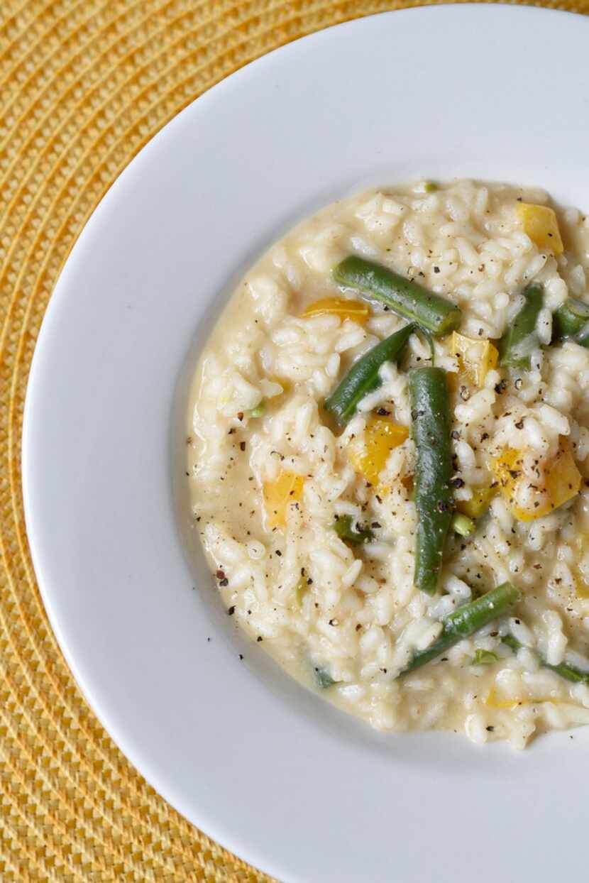 A dish of Marcella Hazan's risotto with green beans and sweet yellow bell peppers 