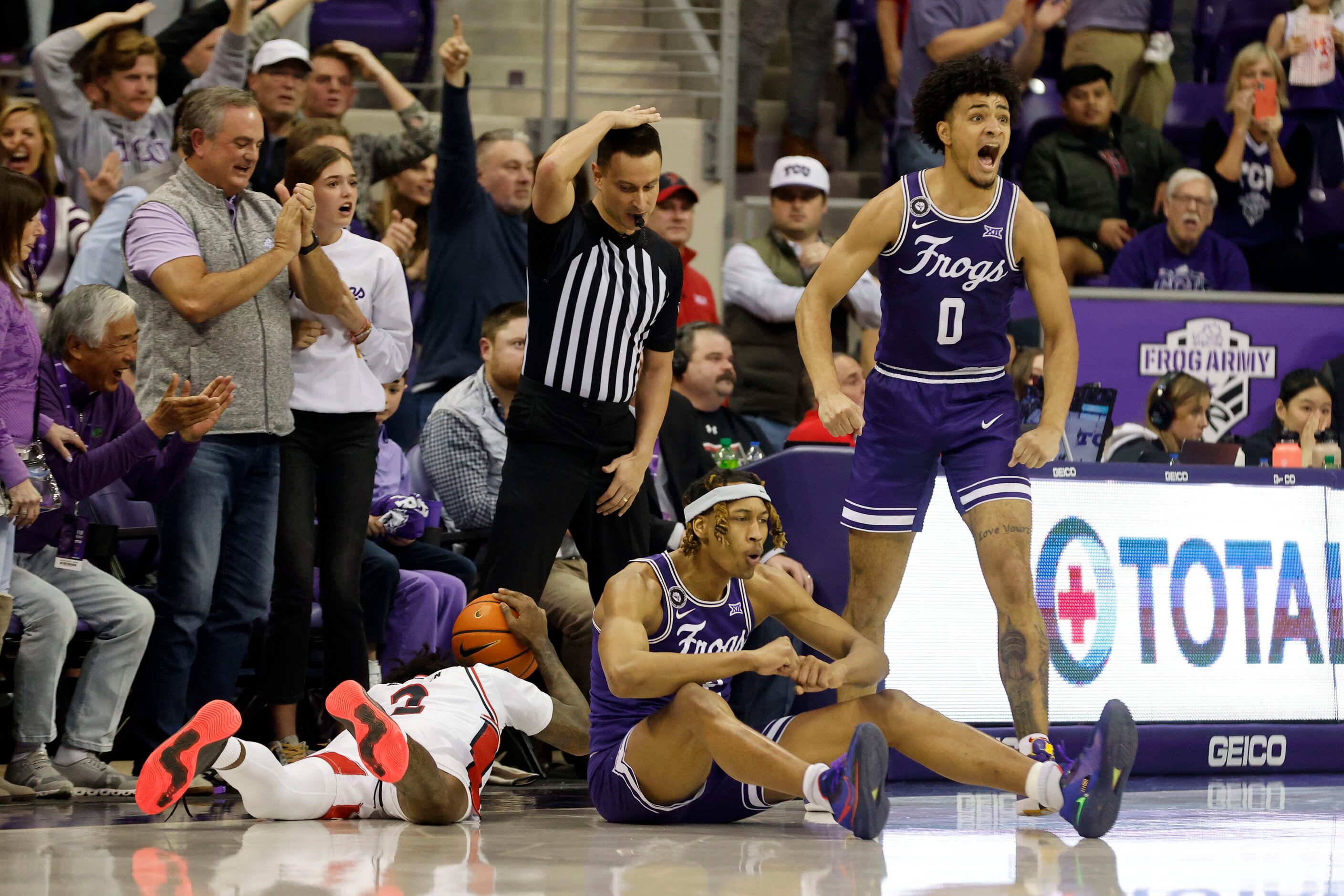 =Texas Tech guard Davion Warren (2), left, TCU forward Xavier Cork, center and guard Micah...