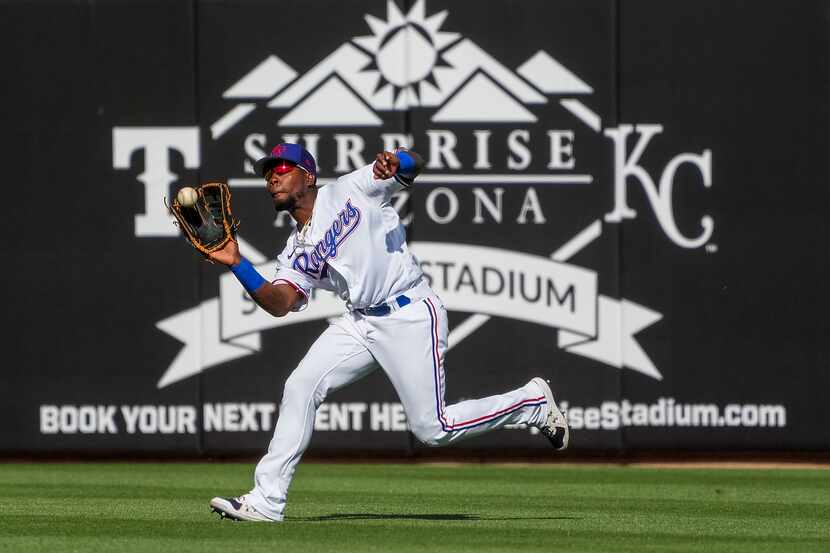 Texas Rangers outfielder J.P. Martinez makes a running catch in right field during the ninth...