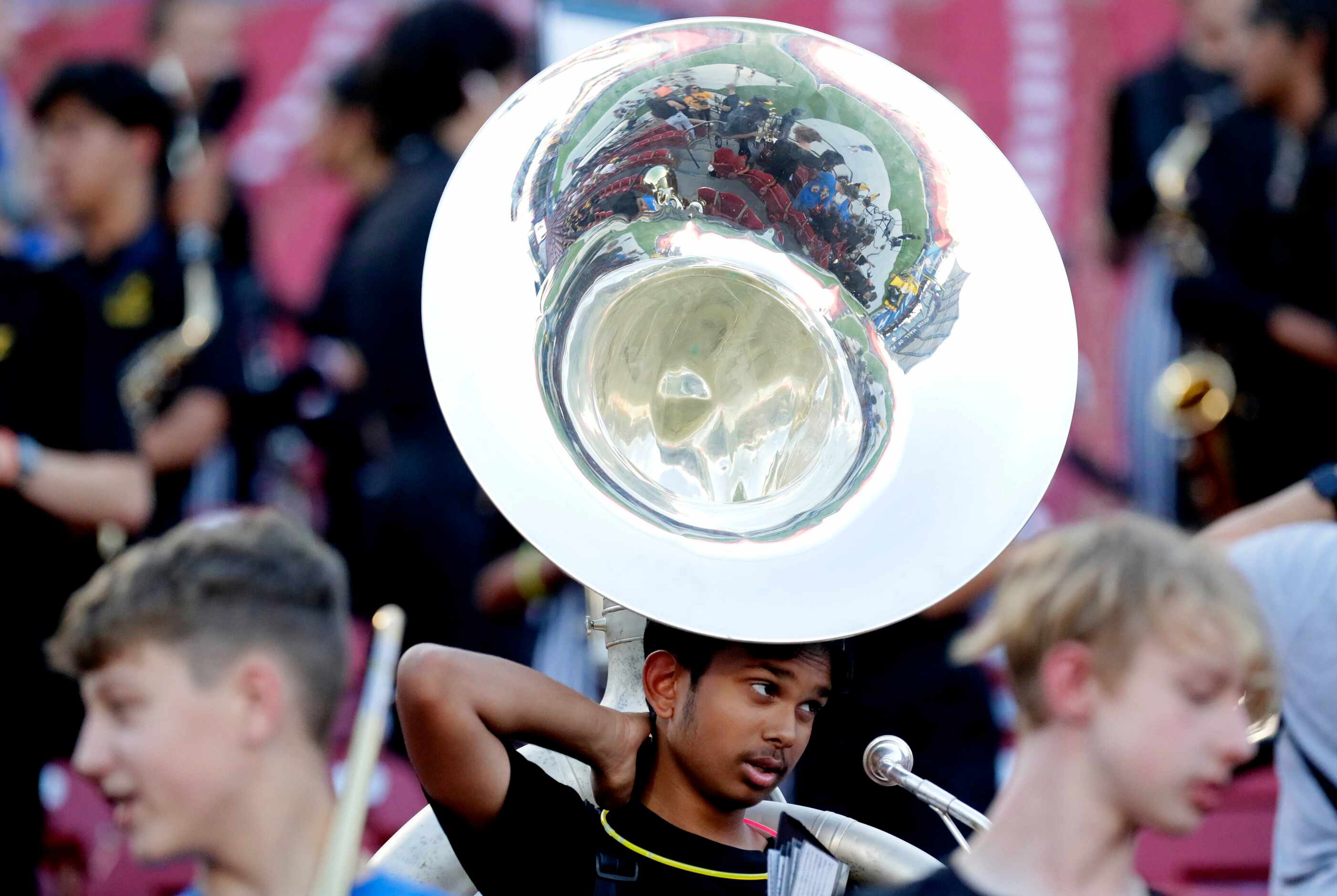 Memorial High School band member Adarsh Patil holds the sousaphone before kickoff during the...