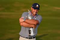Bryson DeChambeau holds the trophy after winning the U.S. Open golf tournament Sunday, June...