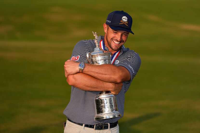 Bryson DeChambeau holds the trophy after winning the U.S. Open golf tournament Sunday, June...