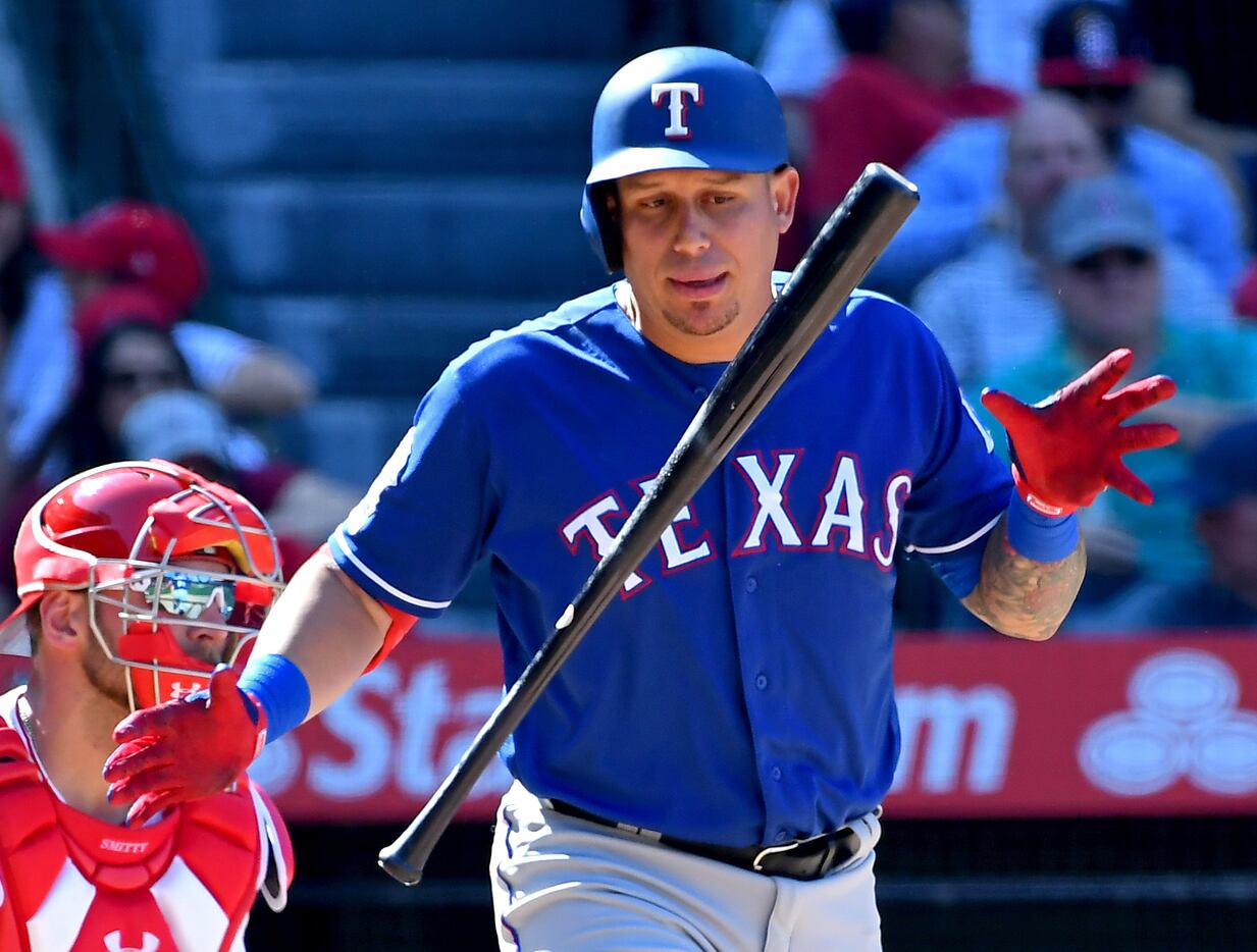 ANAHEIM, CA - APRIL 06: Asdrubal Cabrera #14 of the Texas Rangers flips his bat after he is...