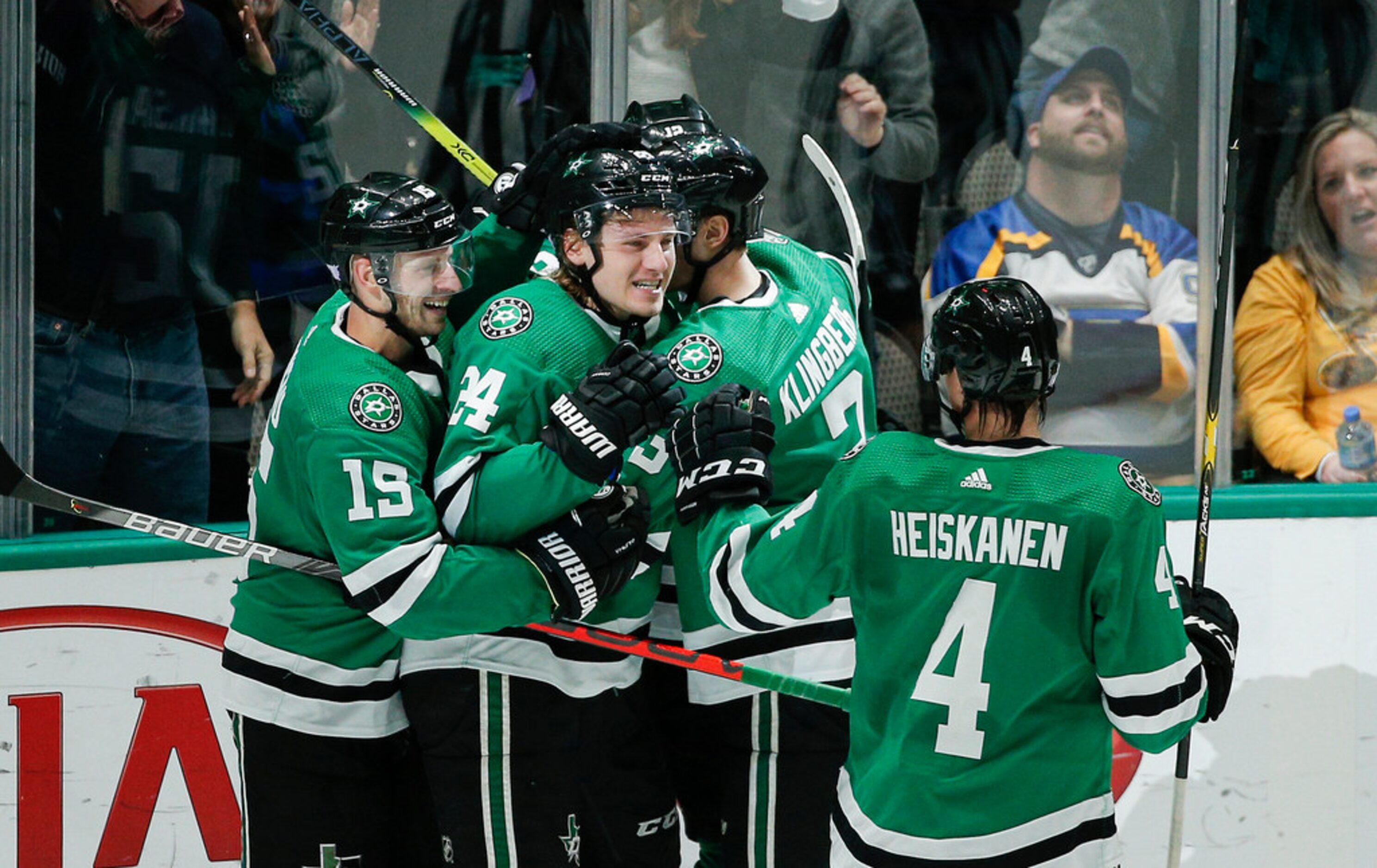 Dallas Stars forward Roope Hintz (24) is congratulated by teammates after scoring a goal...