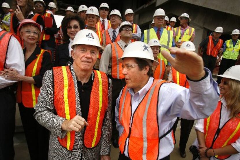 Stadium construction manager and stadium general manager Jack Hill (right) pointed out some...
