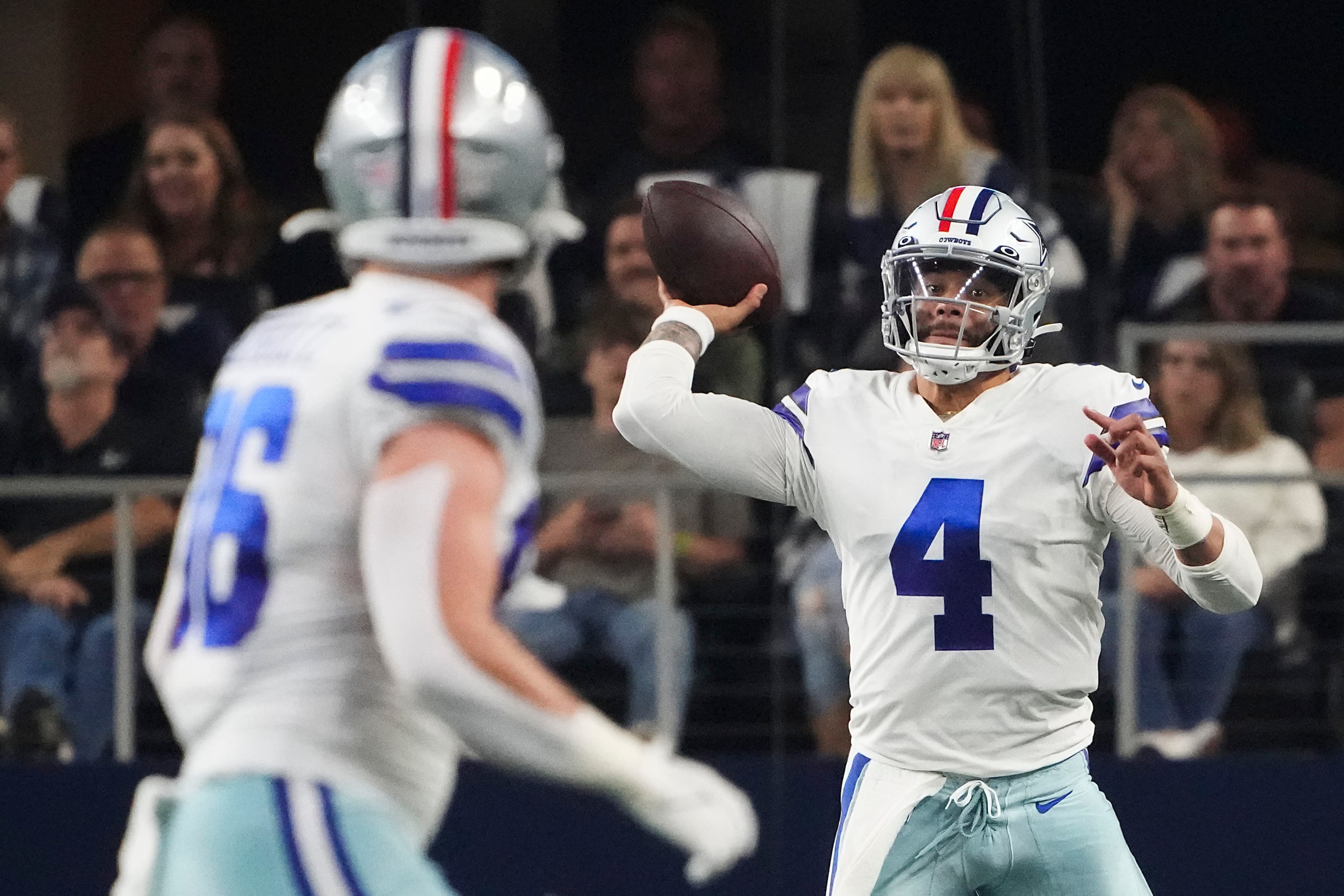 Dallas Cowboys quarterback Dak Prescott (4) throws a pass to tight end Dalton Schultz (86)...