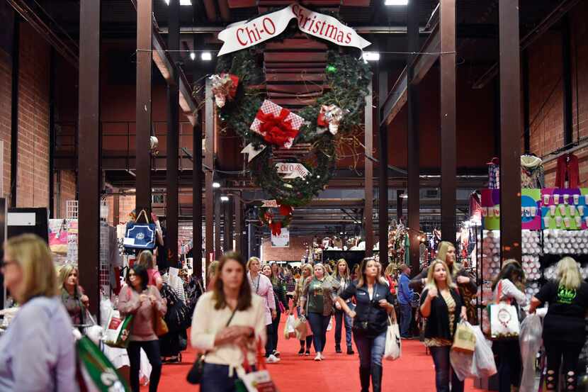 Shoppers walk the main market floor during the Chi Omega Christmas Market at Fair Park in...