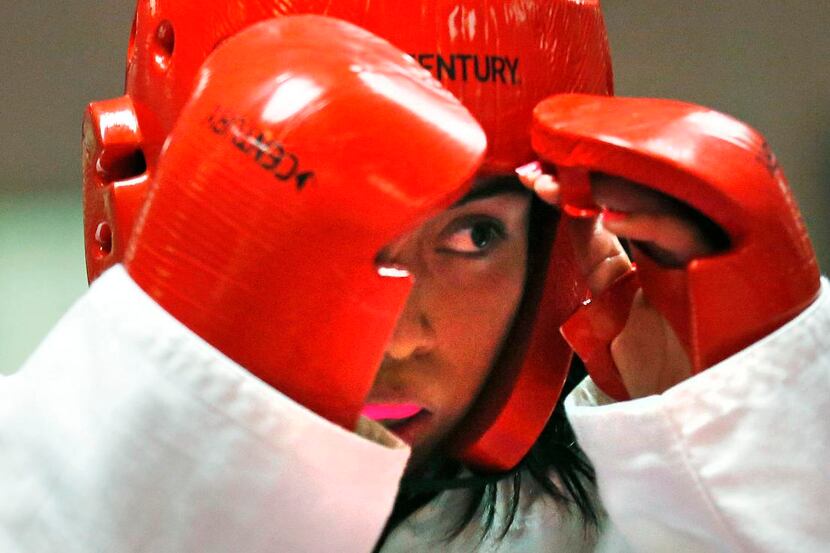 
Daisy Garcia, 16, works on her technique during an advanced class of taekwondo at Plano...