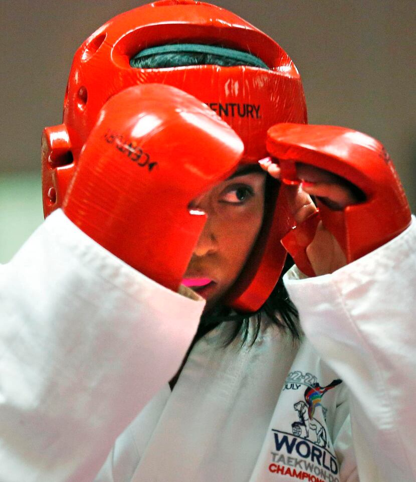 
Daisy Garcia, 16, works on her technique during an advanced class of taekwondo at Plano...