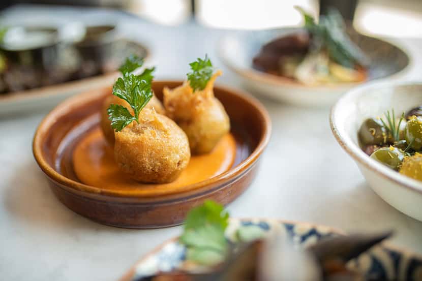 Bacalao Fritters with roasted tomato a oli and roasted garlic at Anise, the Mediterranean...