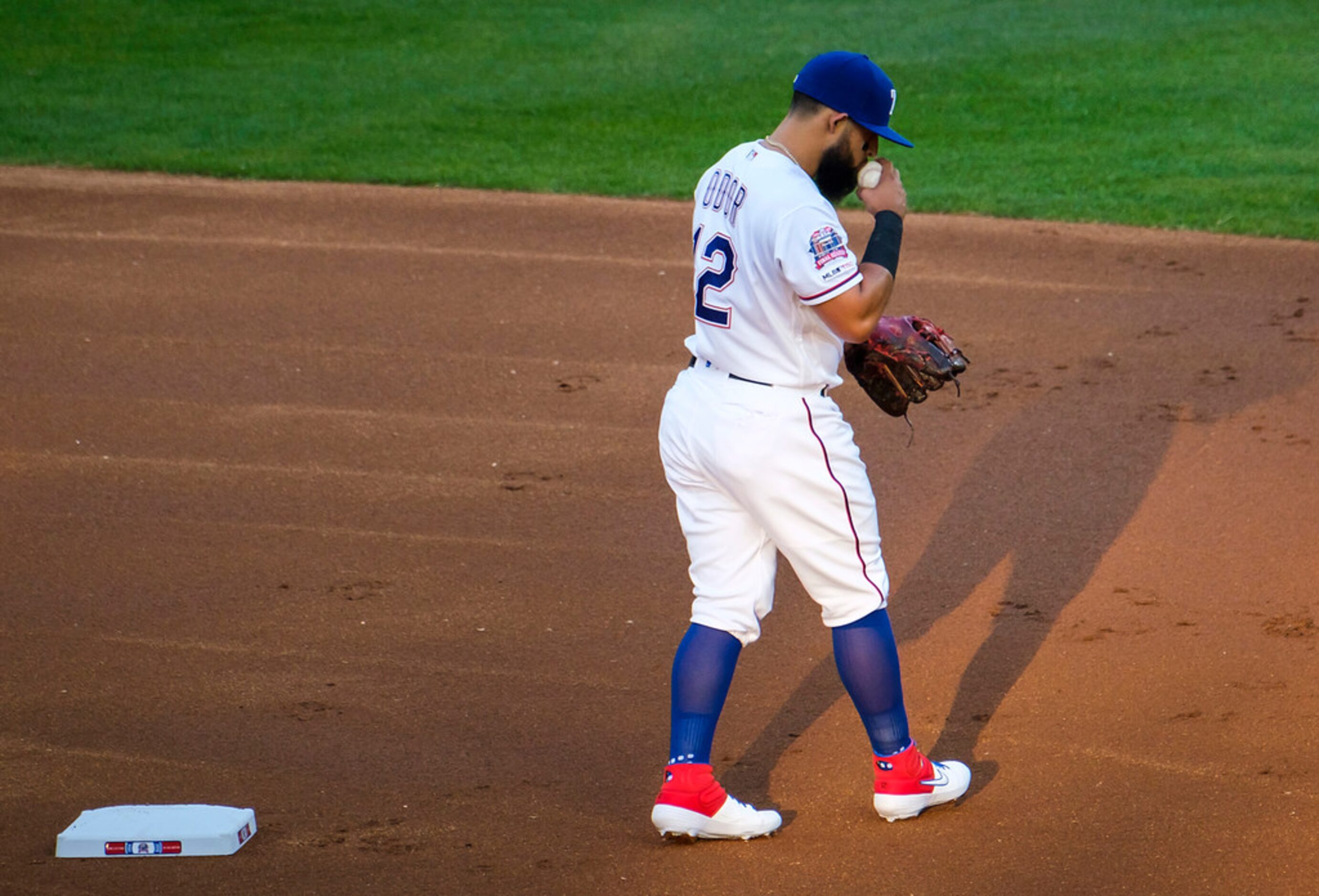 Texas Rangers second baseman Rougned Odor kisses the baseball before the first pitch of a...