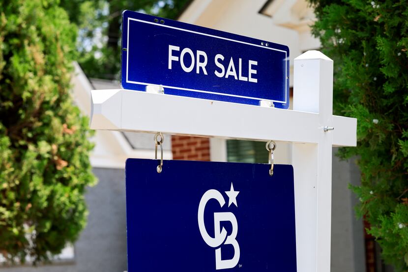 A yard sign advertises a home for sale in Dallas in July. Dallas-Fort Worth saw...