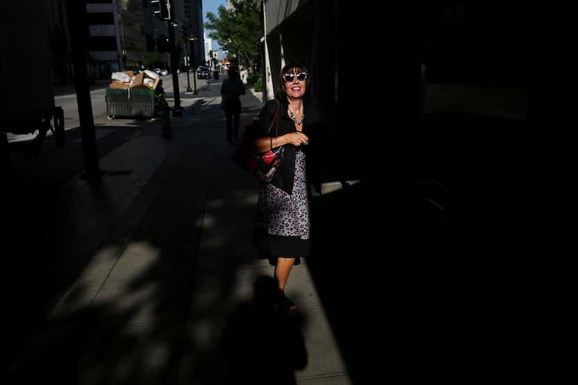 Leslie Chlebak walks along Commerce Street on July 7. 