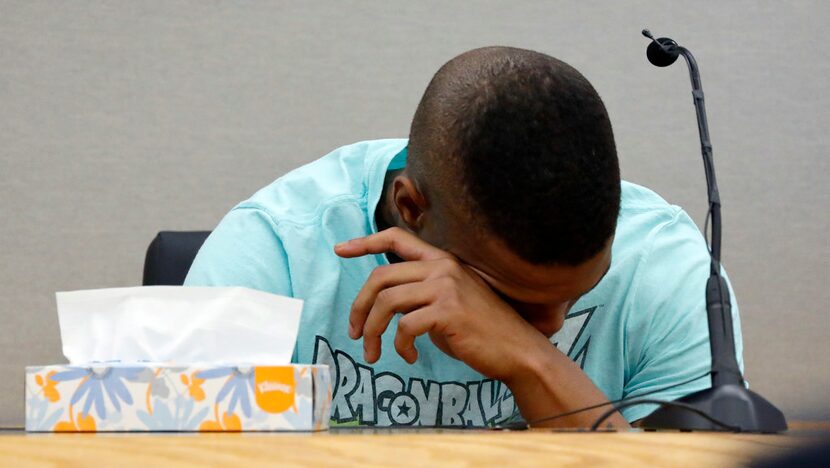 Botham Jean's neighbor Joshua Brown is overcome with emotion after recounting how he'd heard...