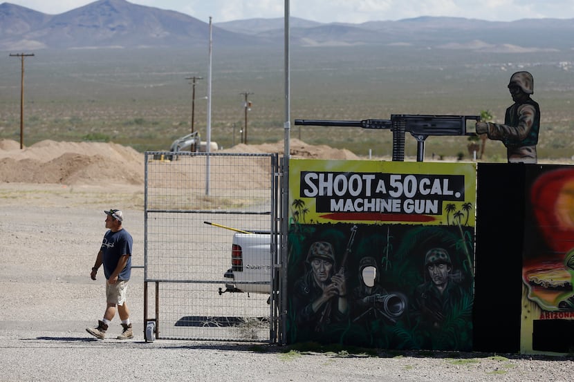 A man closes off an entrance to the Last Stop outdoor shooting range Wednesday, Aug. 27,...