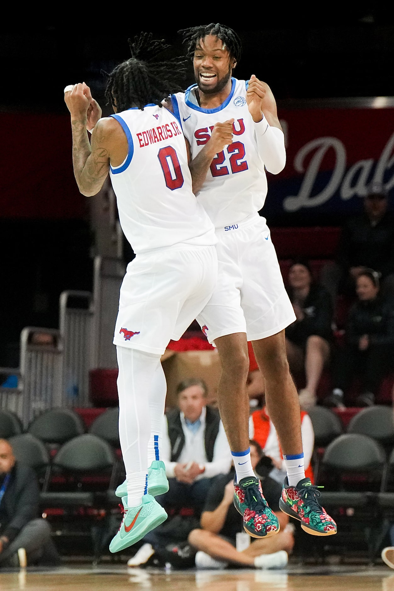 SMU guard B.J. Edwards (0) celebrates with forward Keon Ambrose-Hylton (22) the second half...