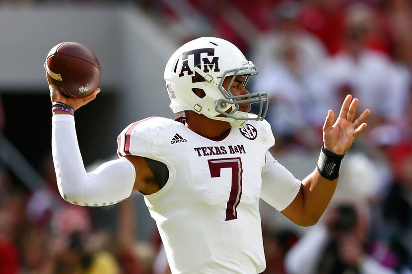 TUSCALOOSA, AL - OCTOBER 18:  Kenny Hill #7 of the Texas A&M Aggies looks to pass against...