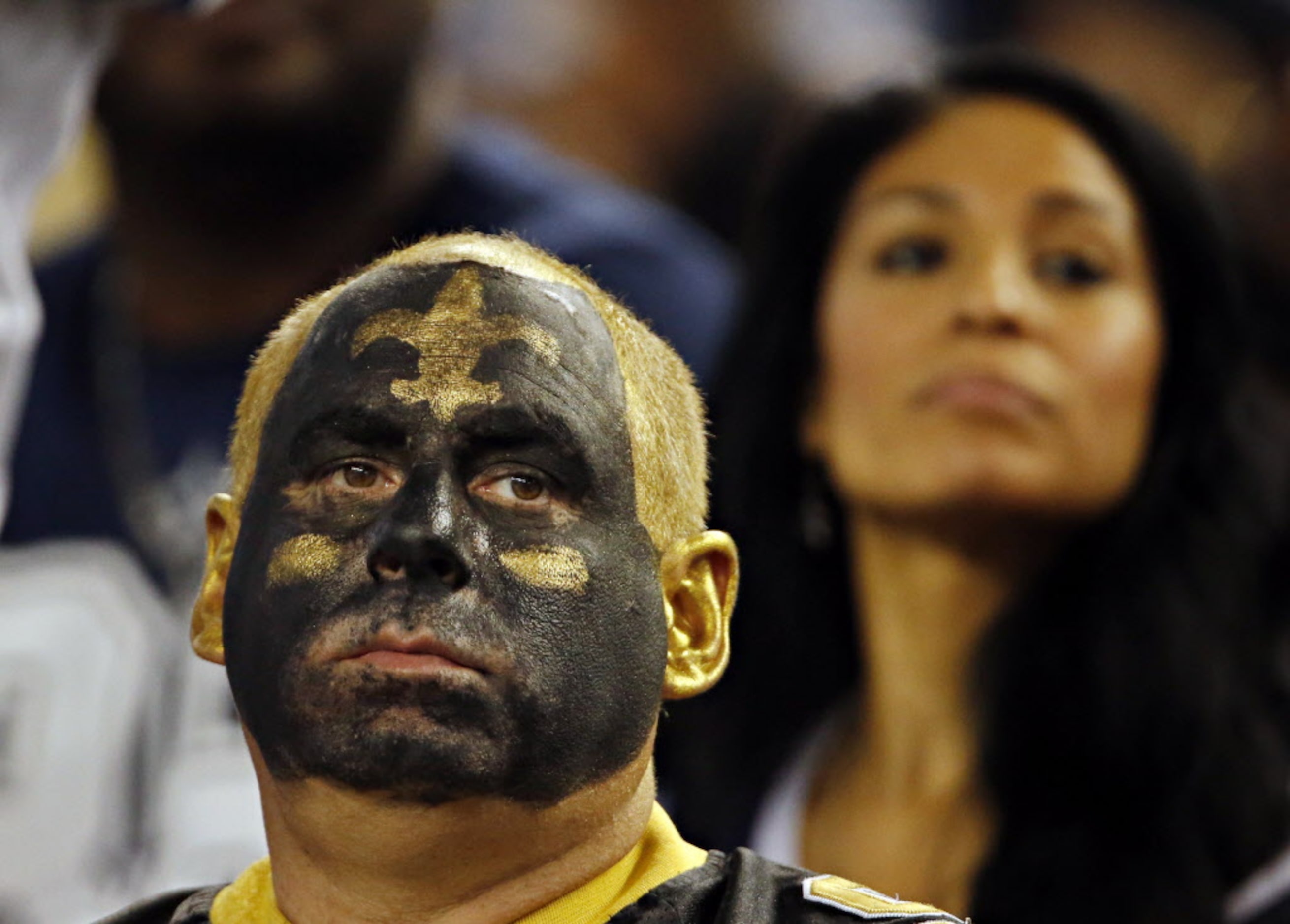 A New Orleans Saints fan looks on dejectedly during the second half of their game against...