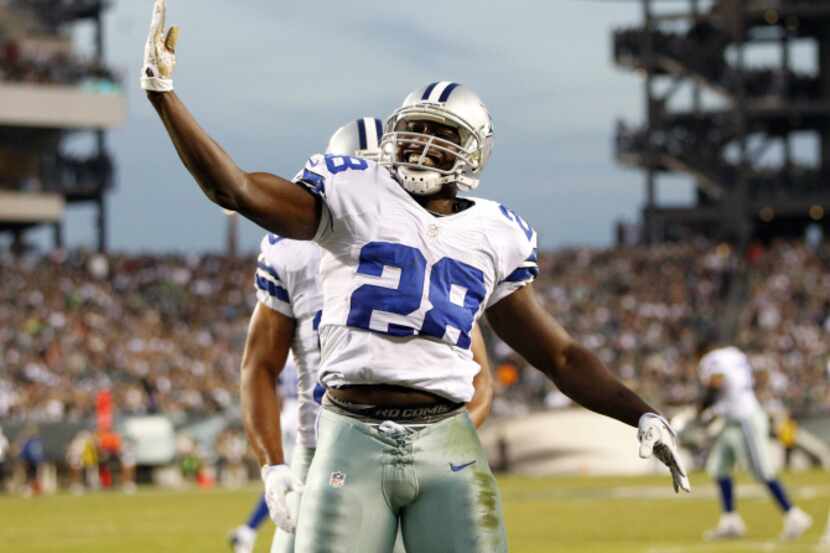 Dallas Cowboys running back Felix Jones (28) celebrates a touchdown in a game against the...