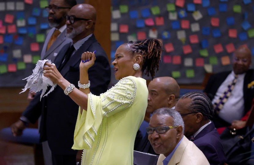 During a service celebrating her retirement, senior pastor the Rev. Sheron Patterson dances...